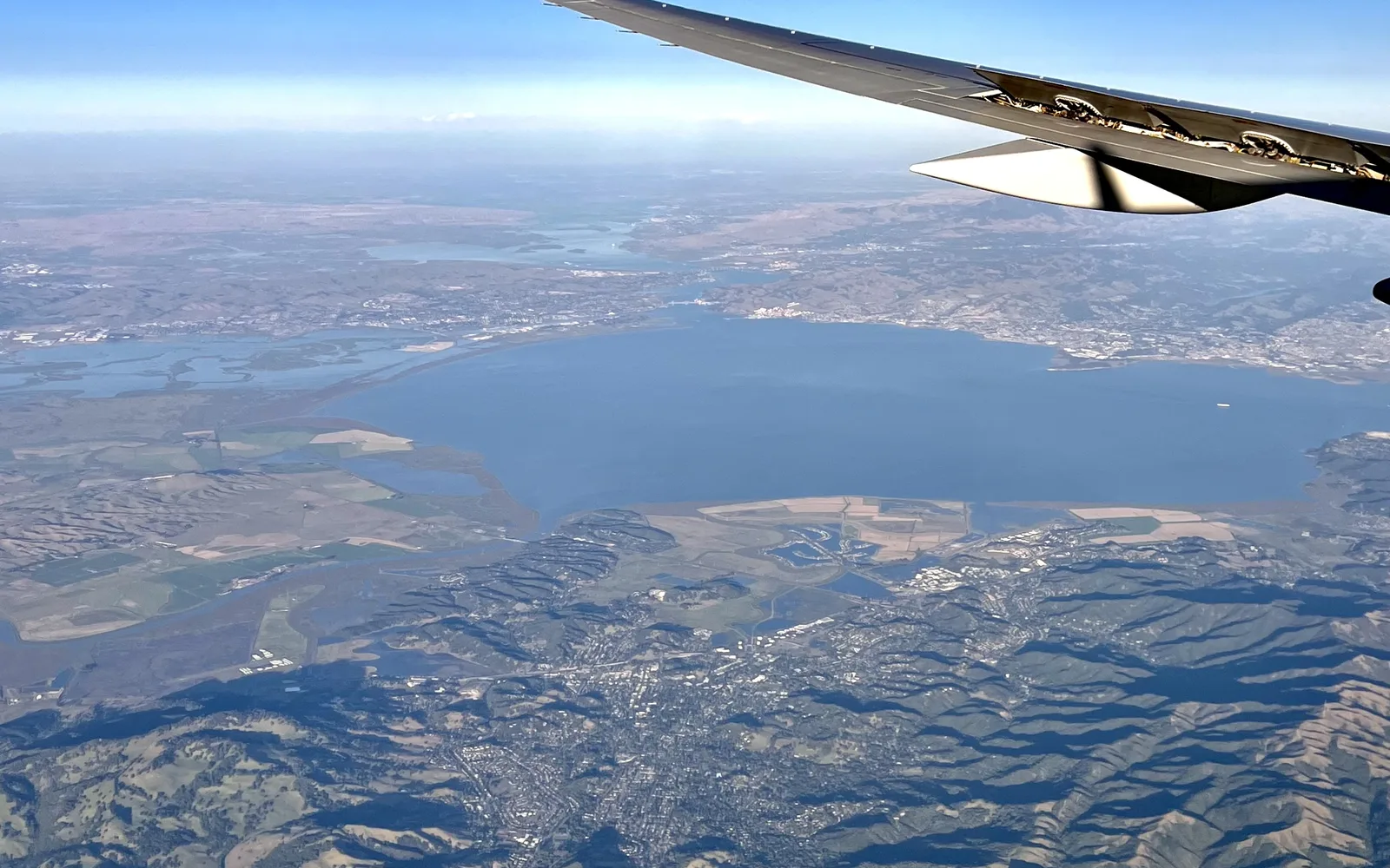 Aerial view of Novato and surrounding Marin County landscape with Stafford Lake and bay visible